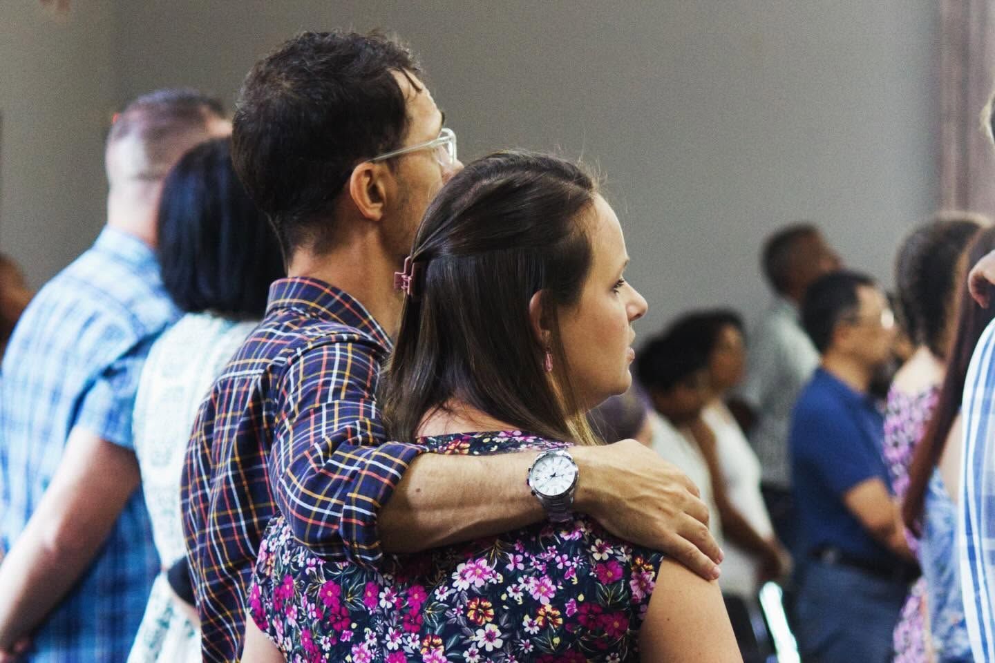 A couple standing together during the service