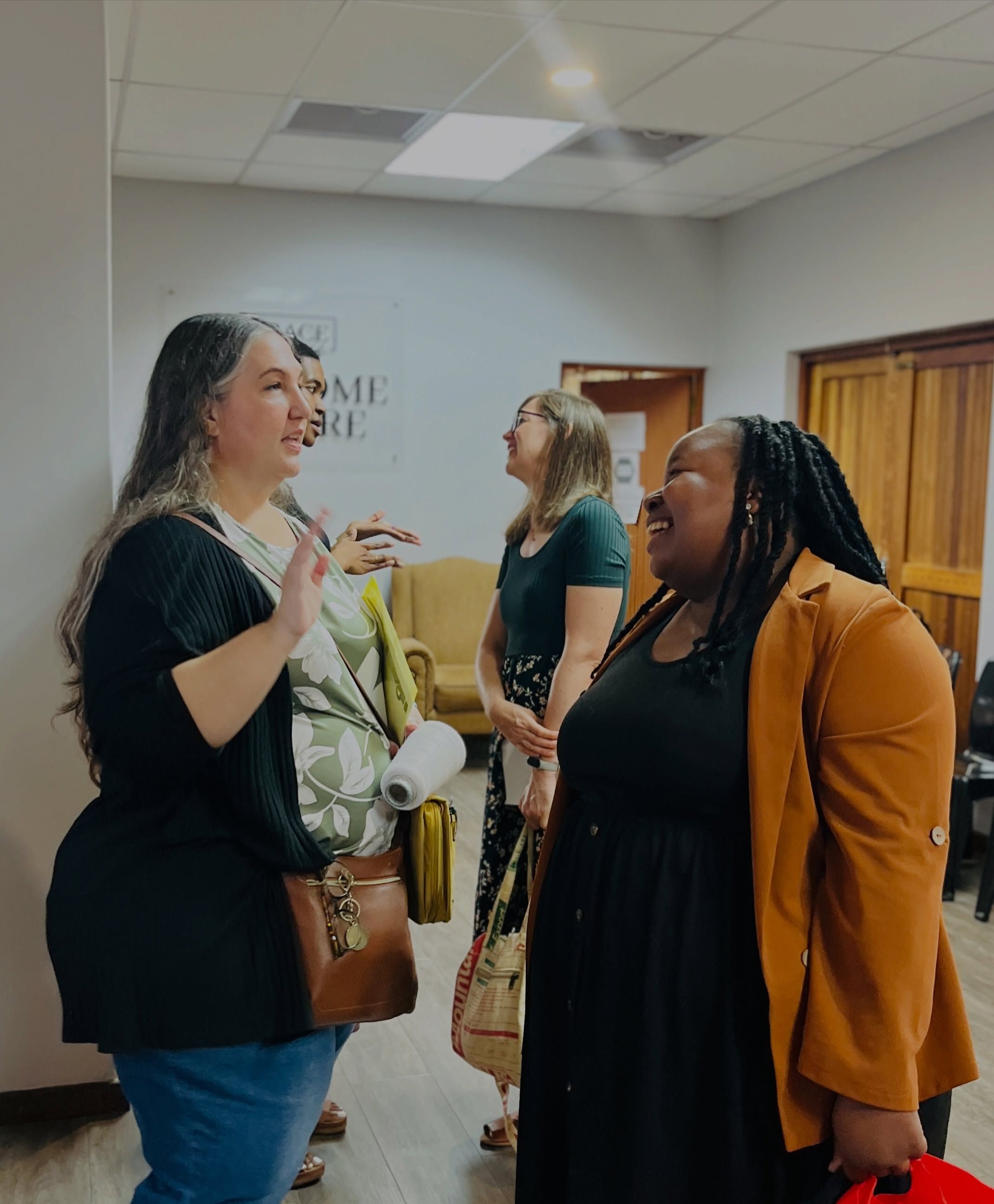 Church members chatting and laughing in the foyer