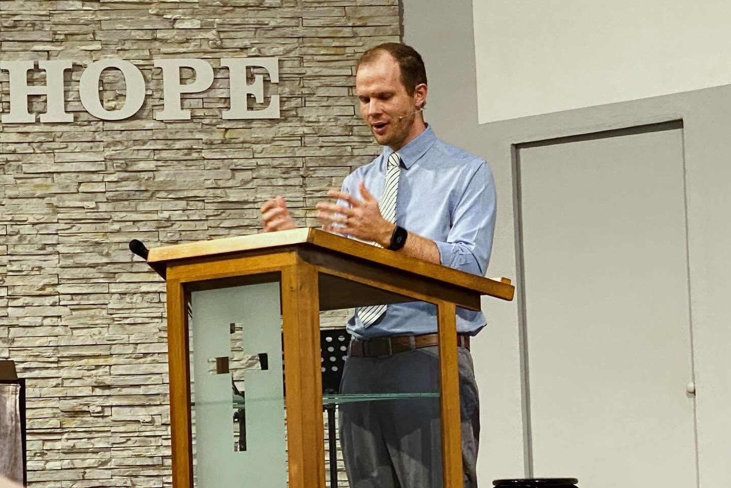 A preacher reading from the pulpit